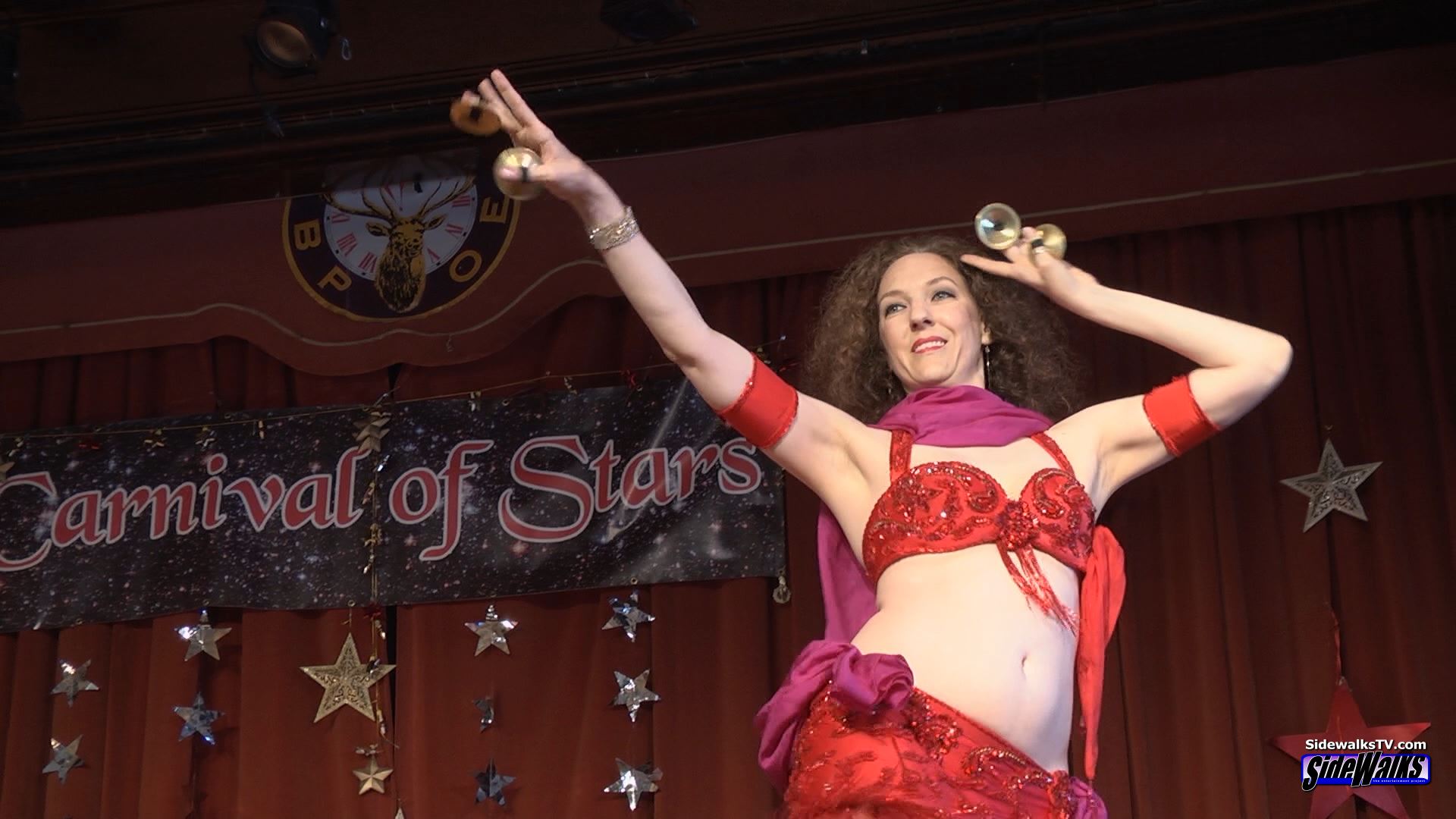 Belly dancer Jennifer Cooper performs on stage at Carnival of Stars