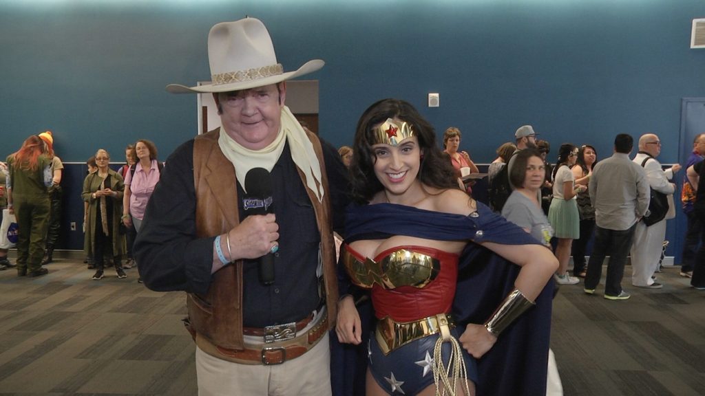 Jeffrey Wayne Sutherland as John Wayne interviews cosplayer Valerie Perez