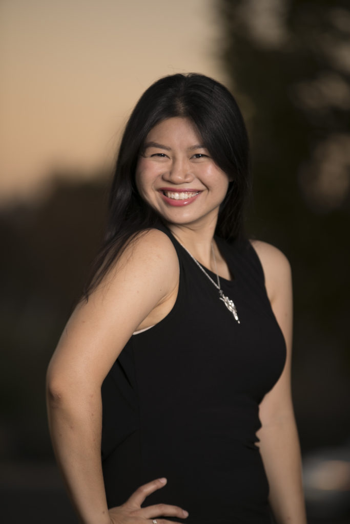 Proud Sangouthai in a black top and smiling