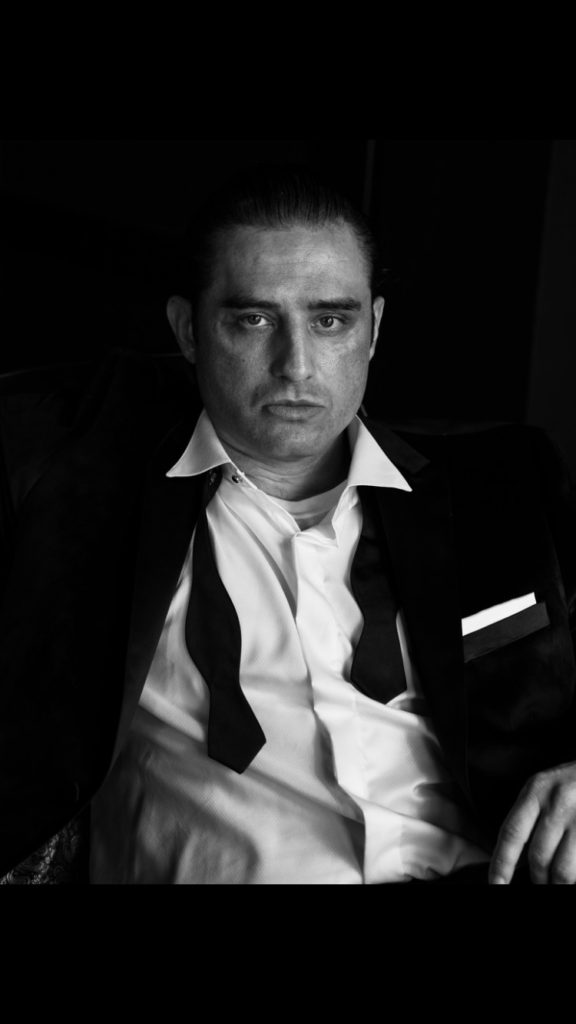 Black and white photo with Trent Buxton in a tux