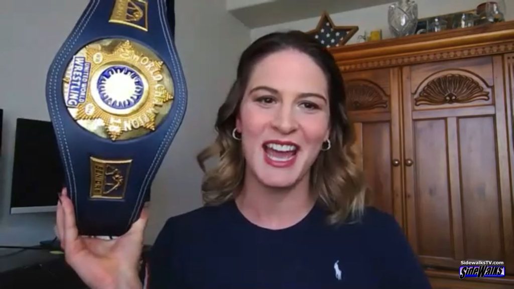 Adeline Gray holds her wrestling belt