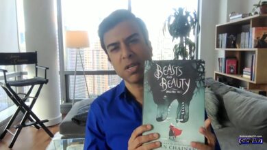 Soman Chainani holds up his latest novel Beasts and Beauty: Dangerous Tales