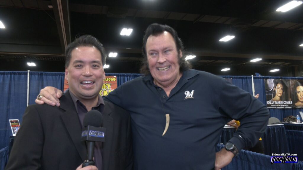 The Honky Tonk Man and Richard look toward the camera