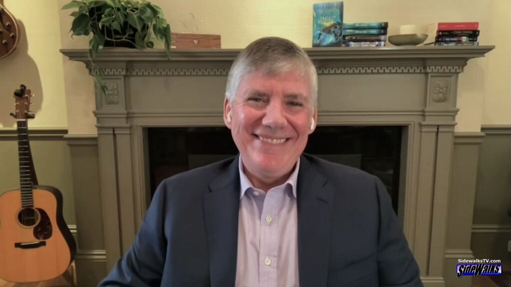 Rick Riordan smiles in a solo shot