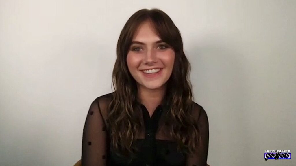 A smiling Emilia Jones