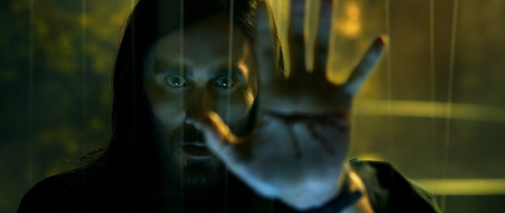 Dr. Michael Morbius (Jared Leto) with his hand up