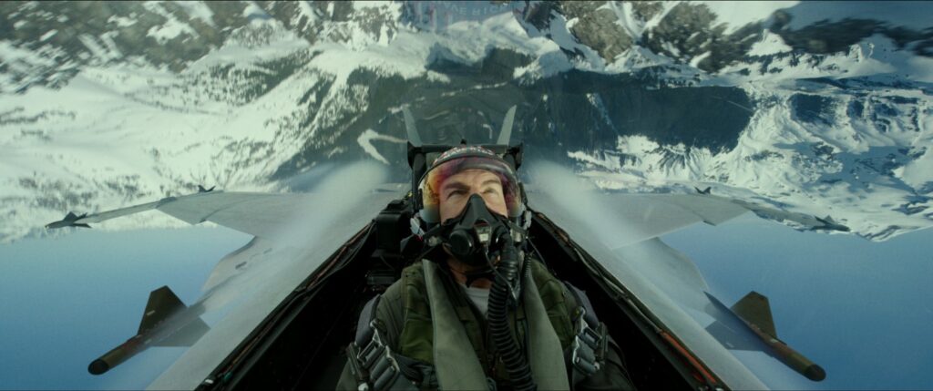 Tom Cruise flying in a jet upside down