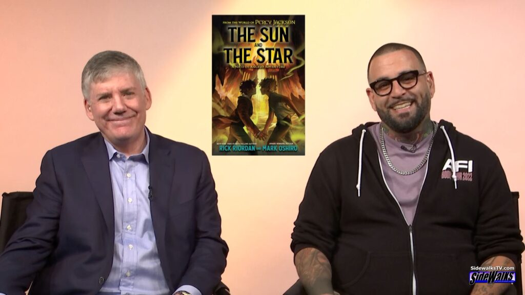 Rick Riordan and Mark Oshiro smile