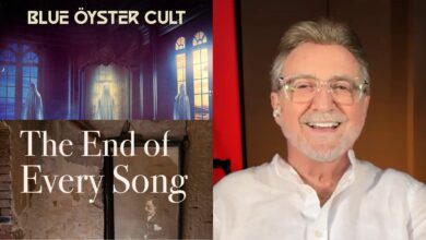 Buck Dharma with album covers: Blue Öyster Cult's latest album Ghost Stories and his solo effort The End of Every Song.