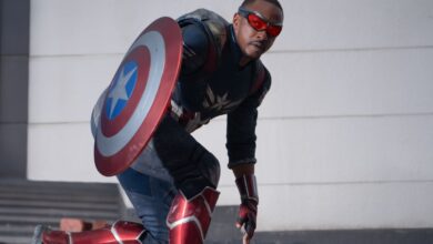 Anthony Mackie as Sam Wilson/Captain America holding his shield in film still.