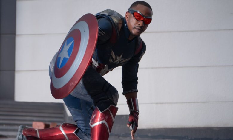 Anthony Mackie as Sam Wilson/Captain America holding his shield in film still.