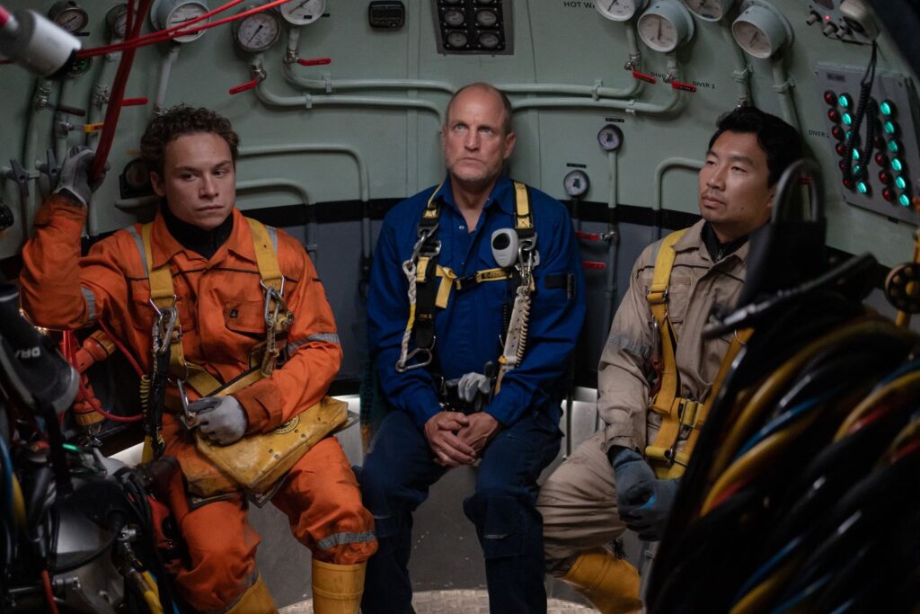 Finn Cole as Chris Lemons, Woody Harrelson as Duncan Allcock and Simu Liu as Dave Yuasa in LAST BREATH.